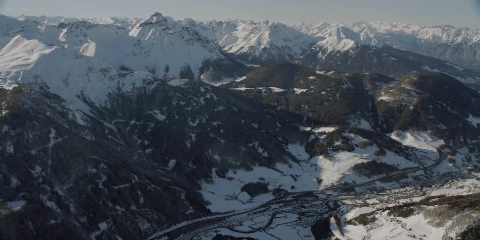 The Brenner Autobahn with Matrei Village and mountain range in winter