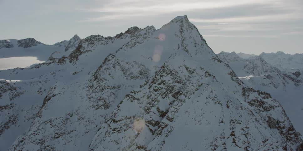 Snow covered mountain peaks on a sunny day