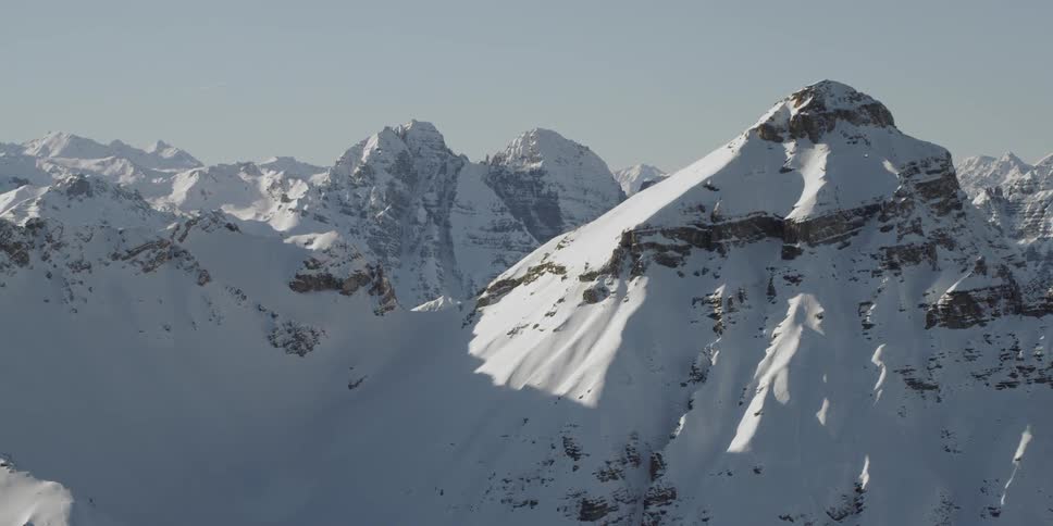 Snow-covered mountains on a fairly clear day