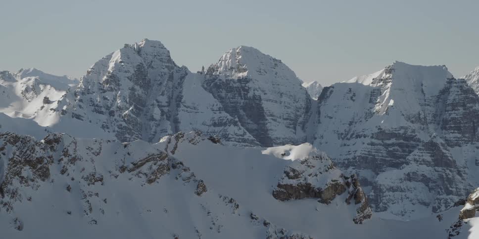 The tall mountains are all covered with snow
