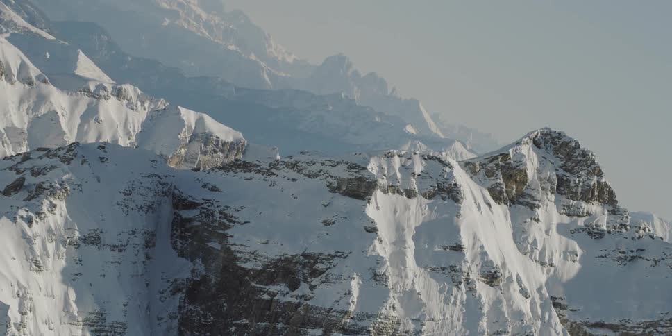 Snow covered mountain ridges and peaks on a sunny day