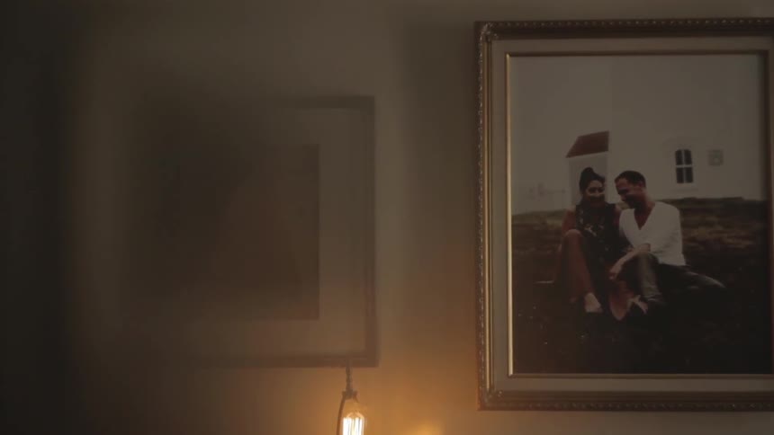 Couple of portraits hanging on a wall