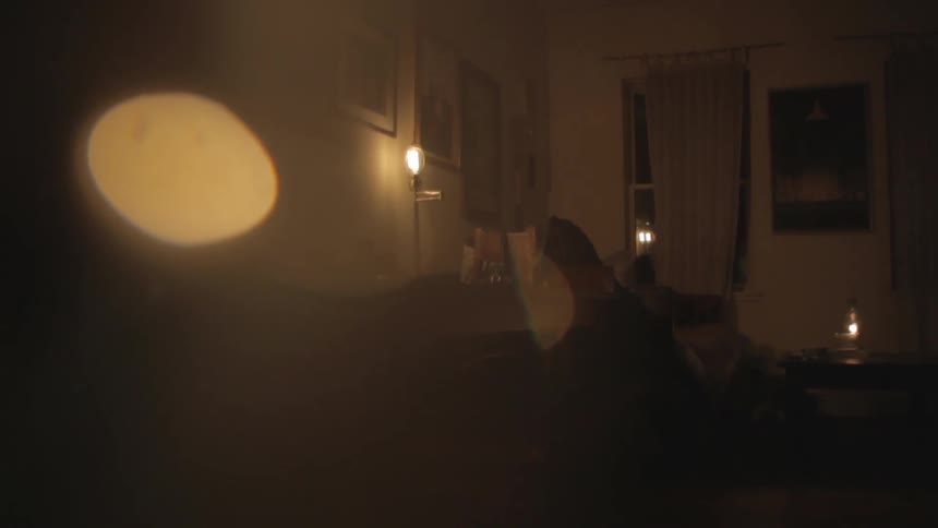 A lamp shines in a home