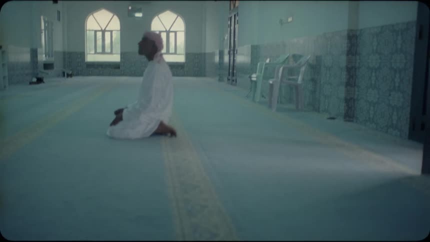 A man prays inside of a mosque