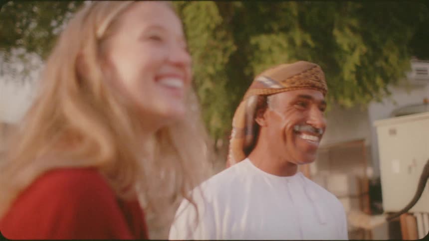 Man and woman smile and laugh