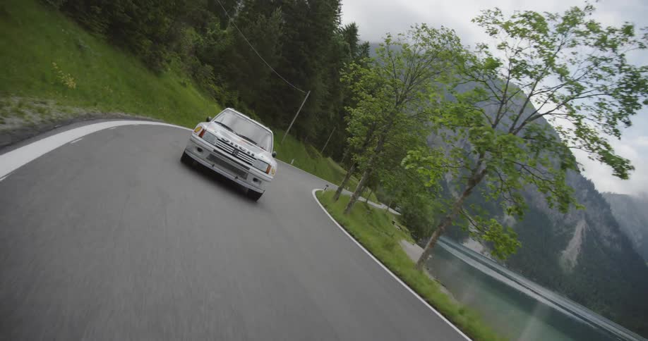 A touring car speeds on the road