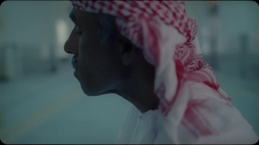 An arab man prays with his eyes closed