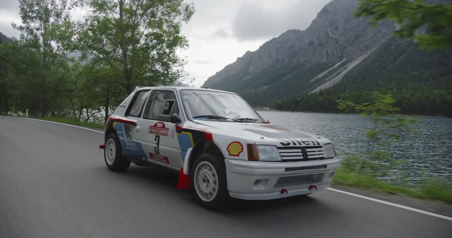 A touring car speeds on the road