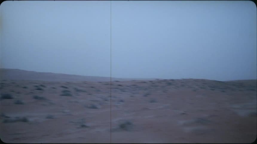 Hilly brushy desert landscape on a cloudy day