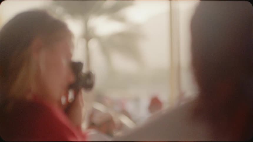 A woman takes photographs outside