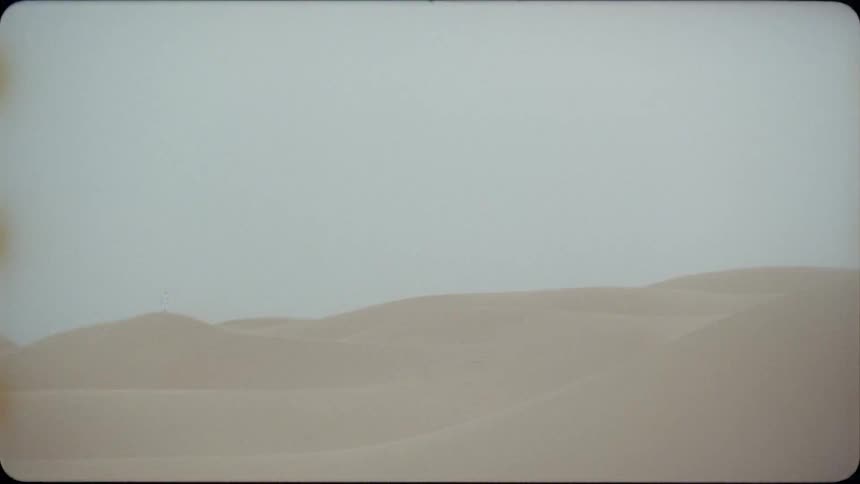 Sand drifts across the dunes in the desert