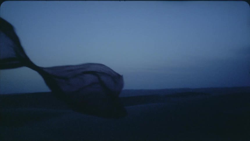 Cloth blows in the wind at sunset