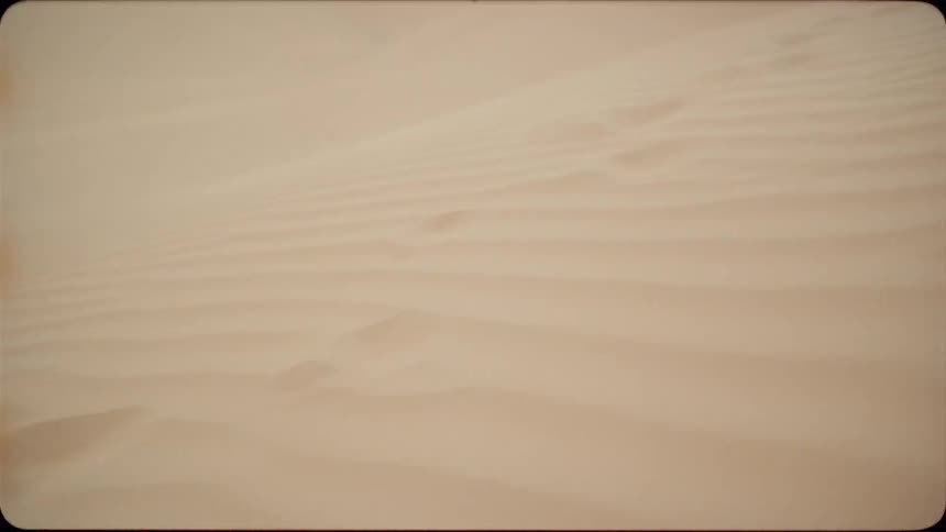 Sand is blown across the desert by the wind
