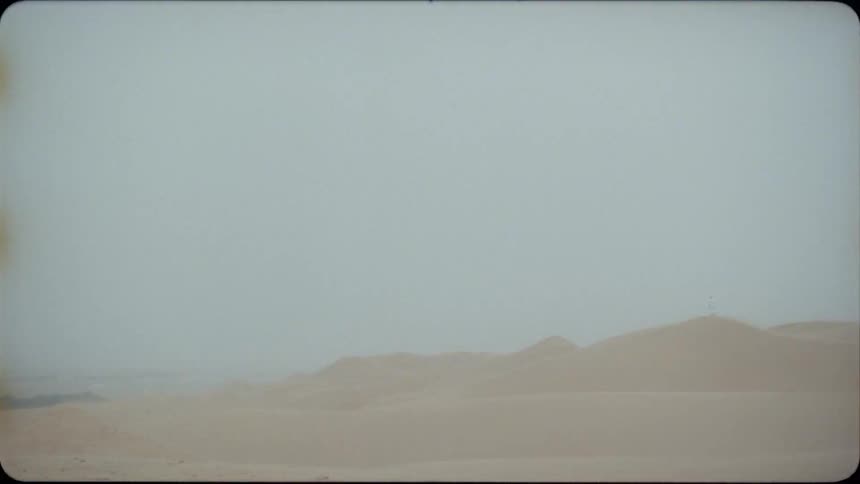 Lightning flashes in the foggy desert