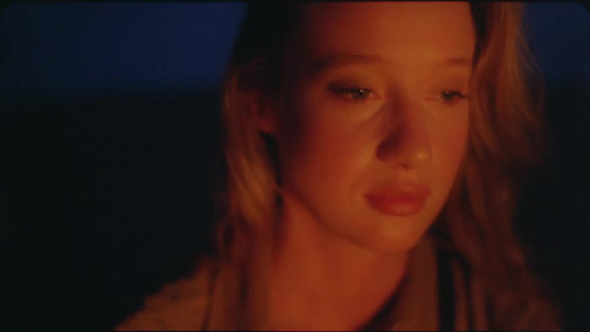 Woman blinks her eyes as she stares