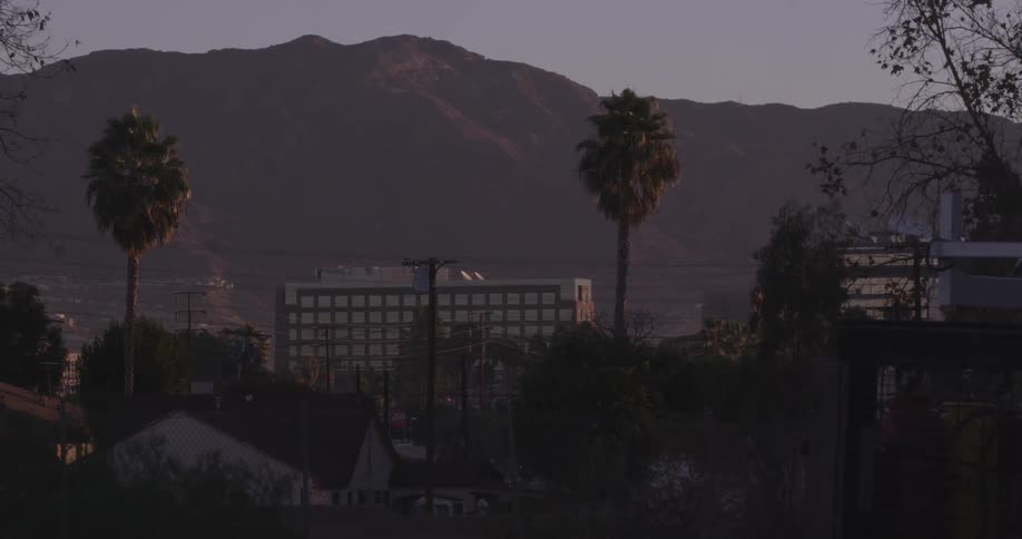 View of some buildings before a large mountain