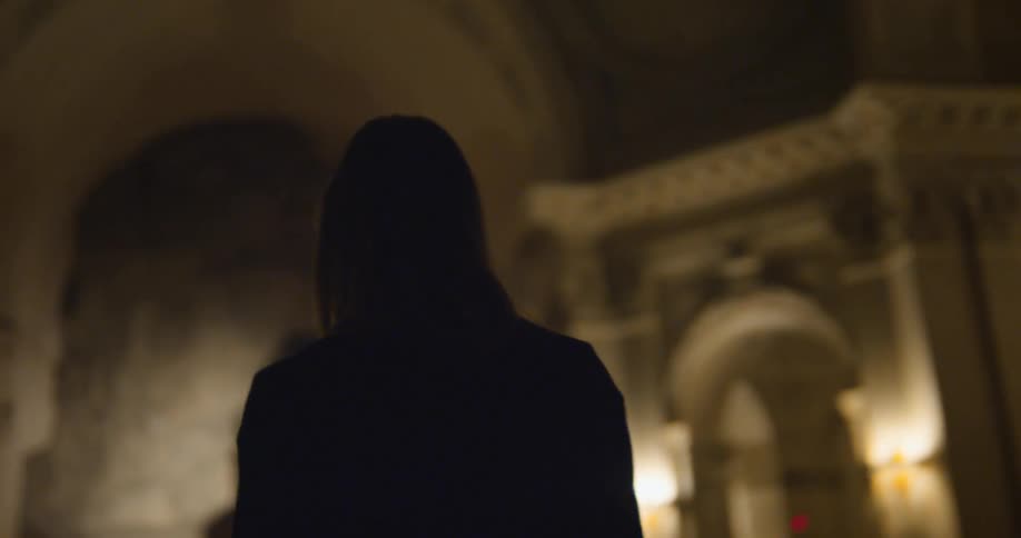 Woman walking through a church