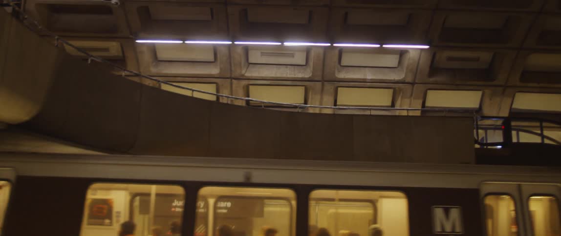 People ride on a train in the subway