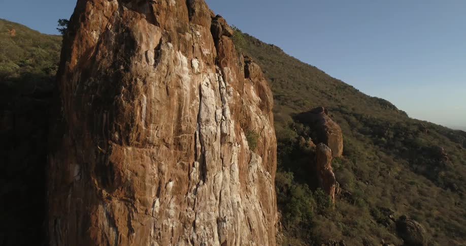 Rock formations on the slope of a hill