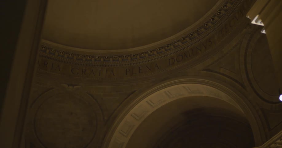 Inside of a large stone building with arches