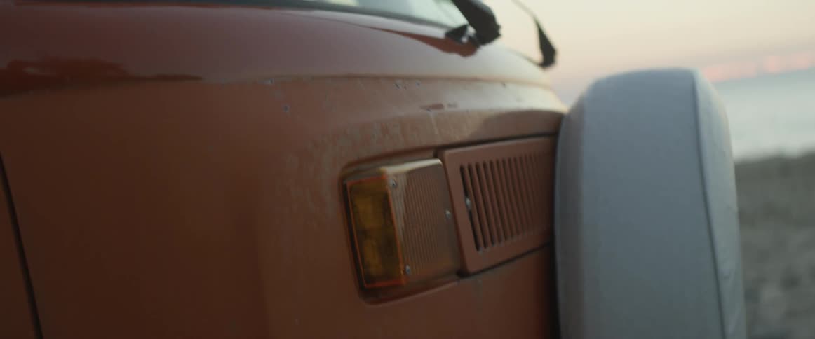 The vehicle is parked on the beach