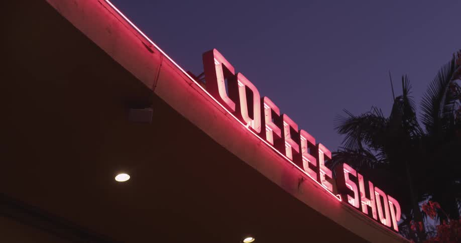 Bright neon sign that says coffee shop