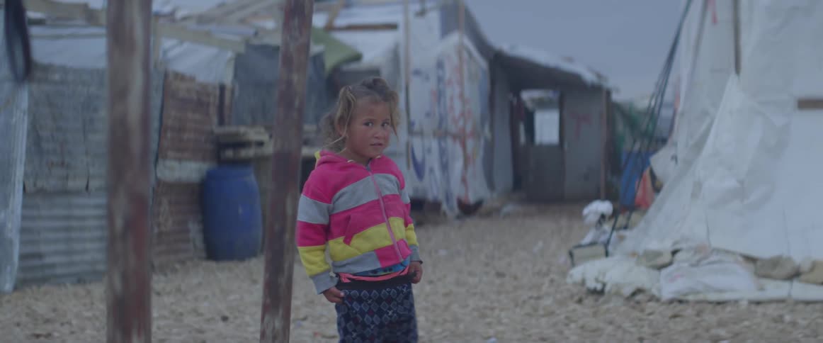 Young girl takes a step with her hands near her pockets