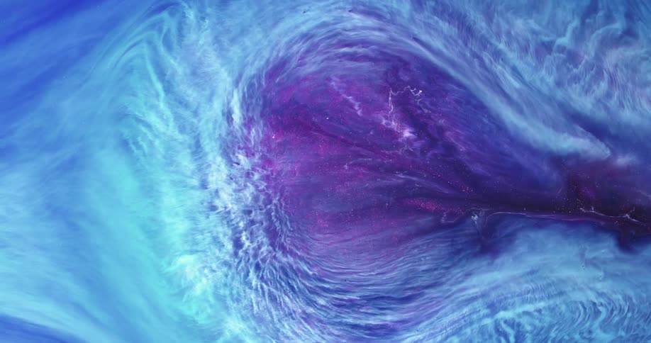 Different colors of liquid swirl together