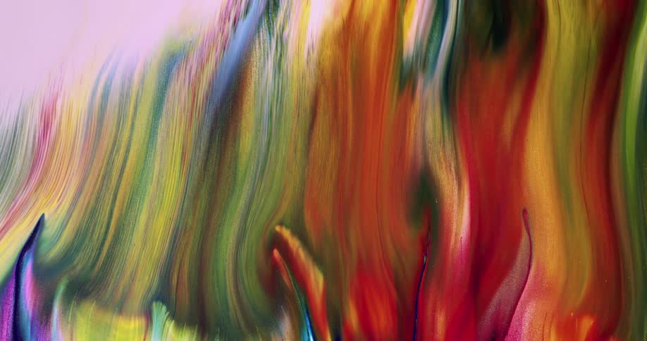 Several colors of liquid mixing together