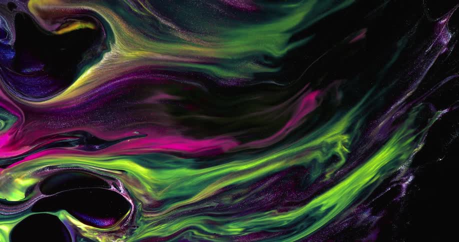 Multicolored liquids swirling and mixing together