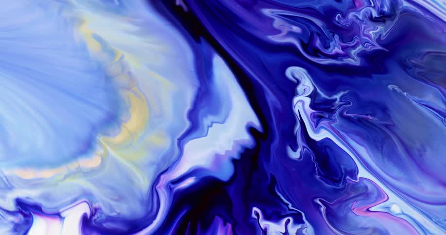 Blue and pink liquid spreads and blends together