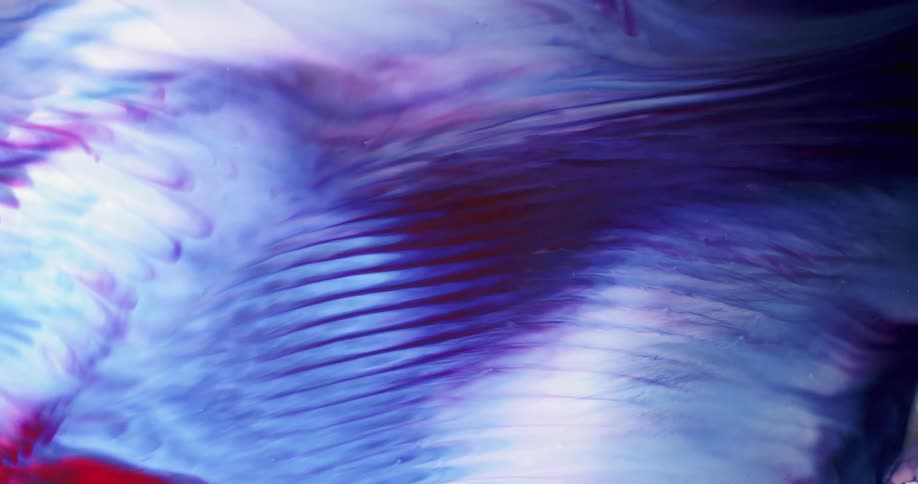 Multiple colors of liquid swirling together