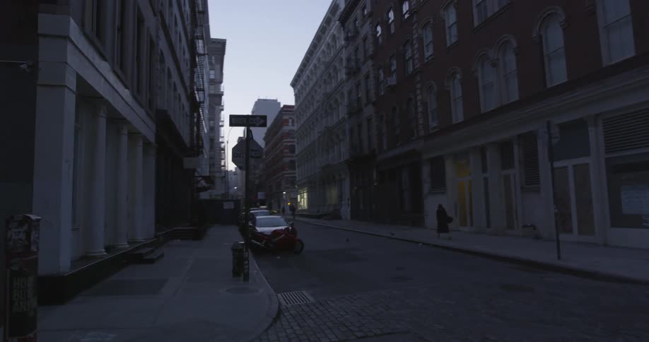 A city street with multi-storied buildings on each side
