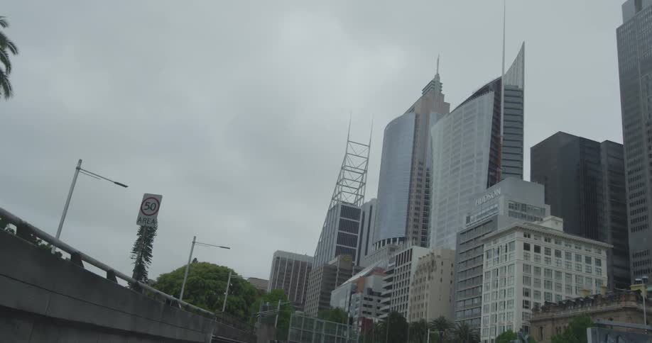View of a city of buildings under a cloudy sky
