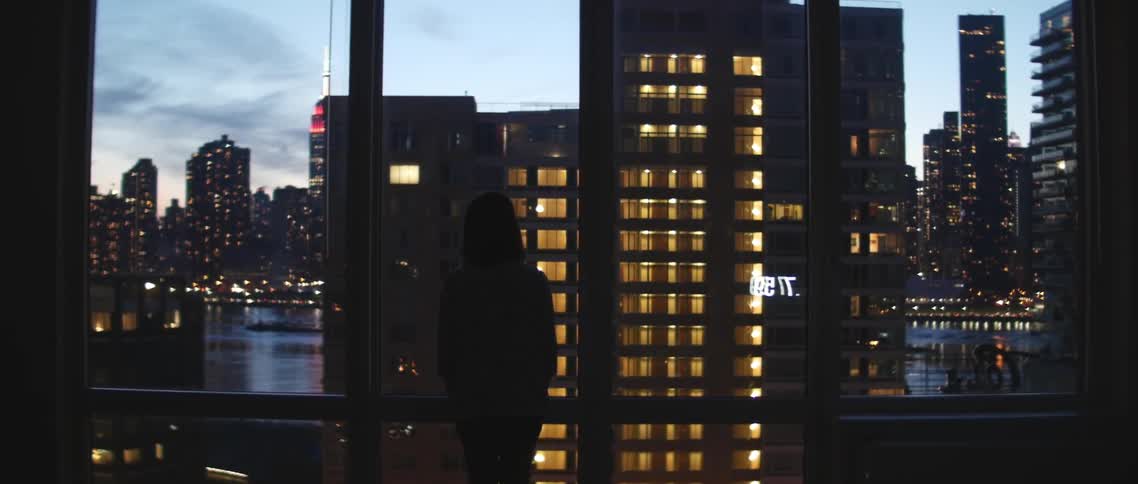 A person looking out of a window