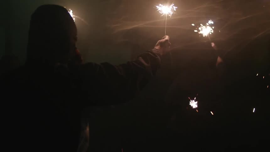 A person holding a sparkler