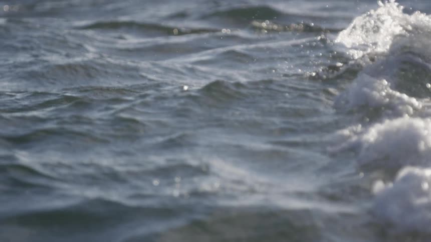Water splashes in a large body of water