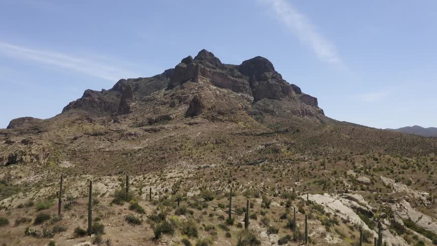 The desert hills lead to a mountain ahead