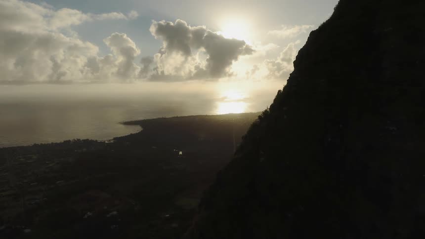 The sun sets over a coastline