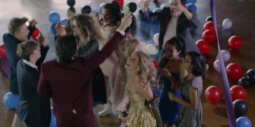A group of teenagers enjoy a school dance