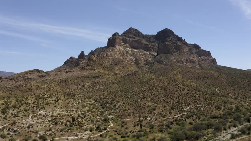 The mountain ahead is covered with green