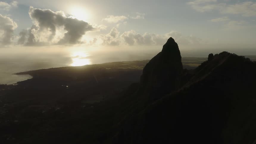 Sun sets over a large body of water