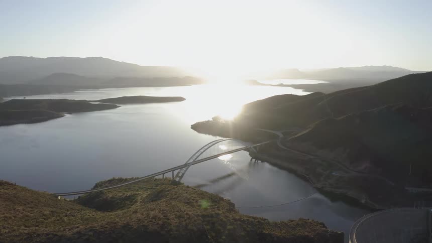 Sun shines over a wide lake