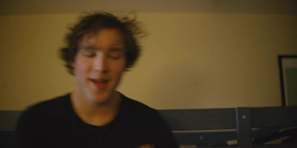 The man is smiling and dancing