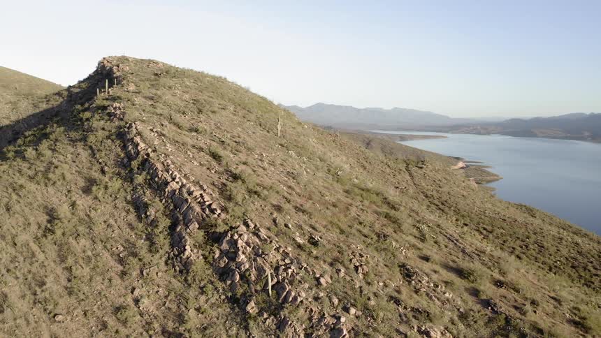 A hilly coast line on a sunny day