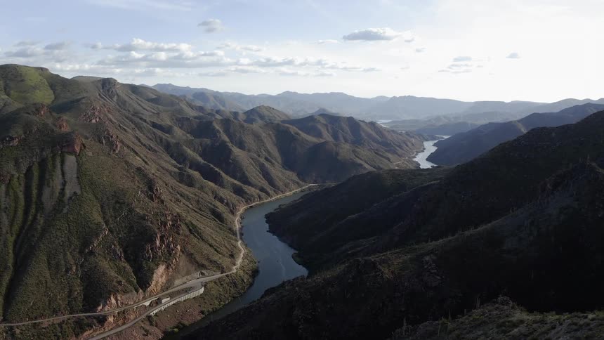 The river runs through the middle of the mountain range