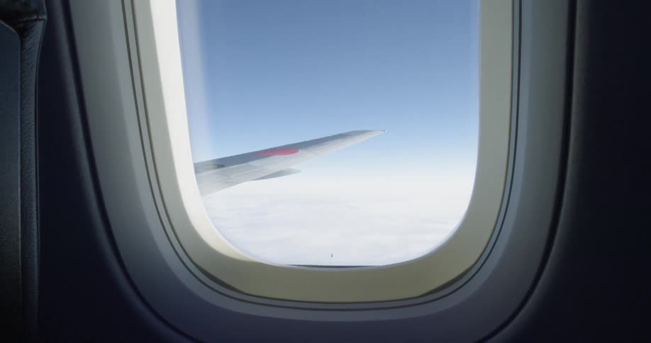 The plane is flying high above the clouds