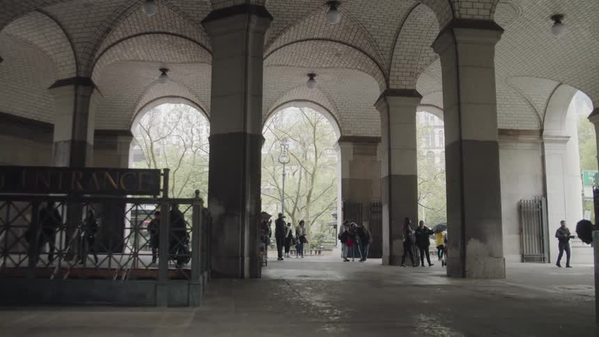 People come up the steps out of the subway