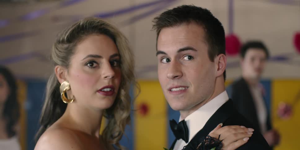Man and woman dance and look over looking surprised