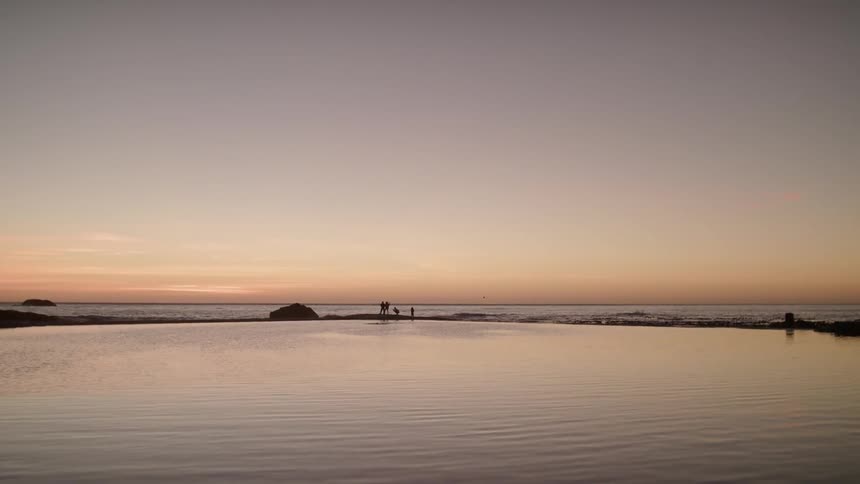 People are standing on the island in the distance